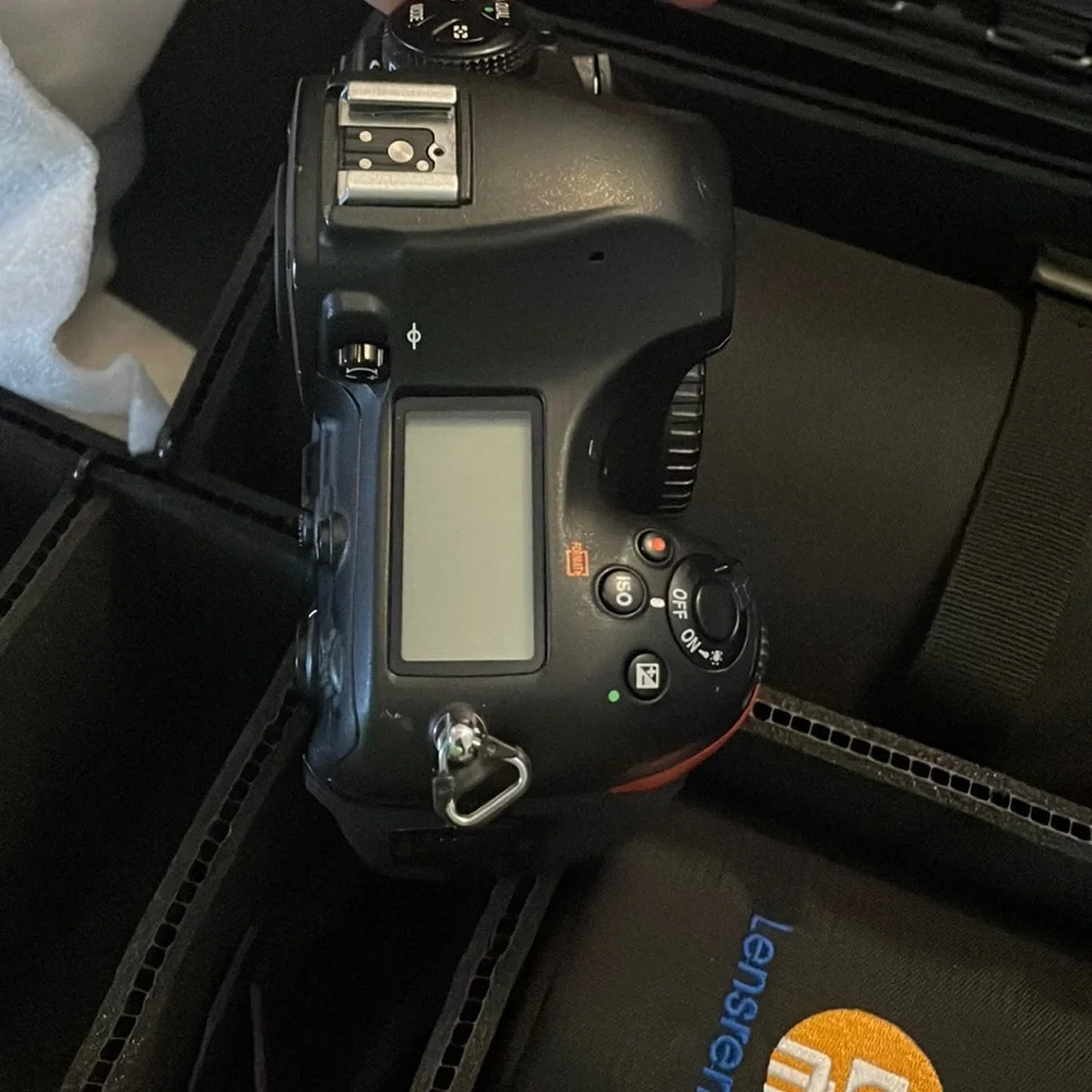 Nikon D850 digital black camera. With battery charger